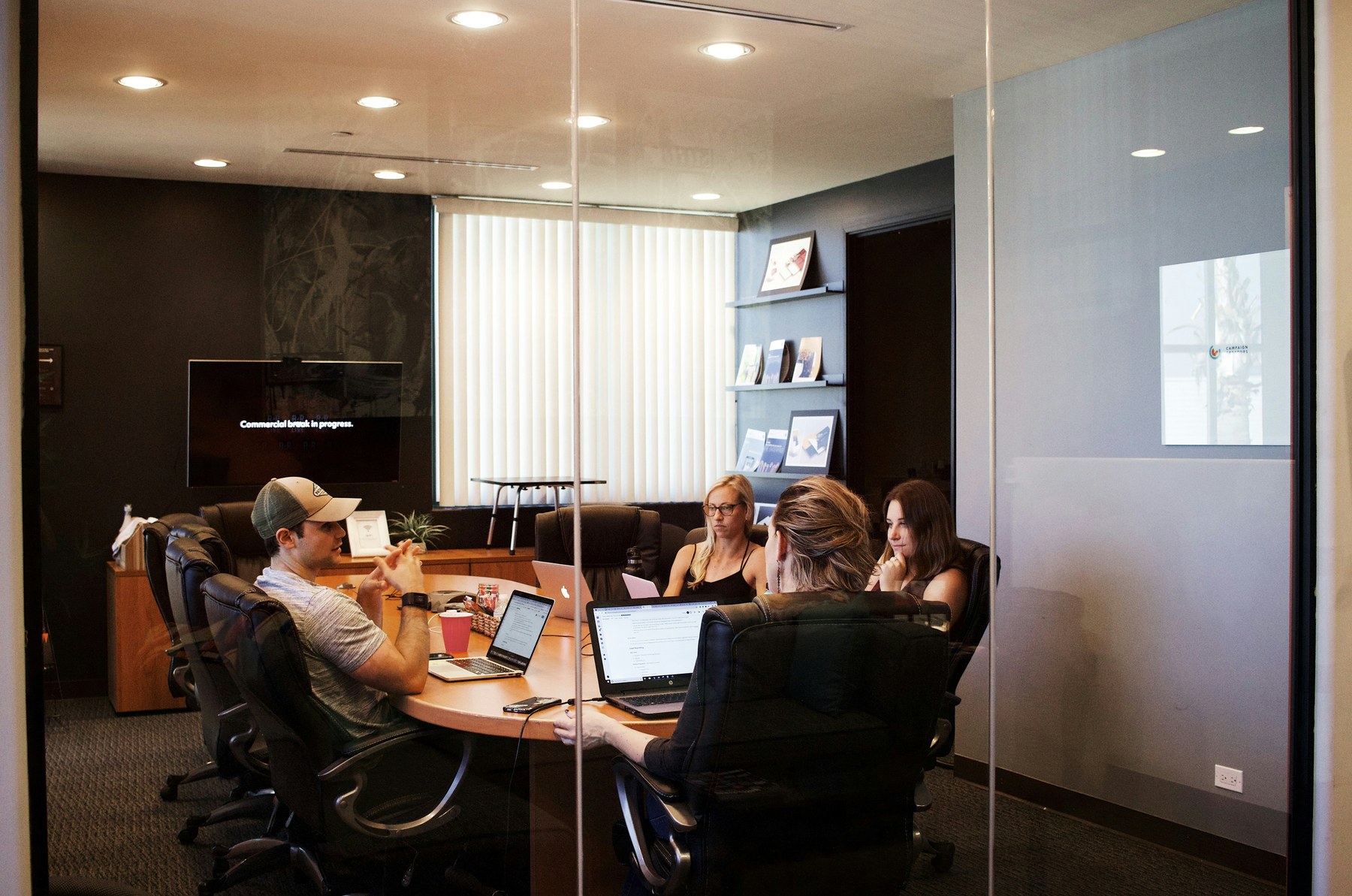 Attorneys and advisors seated around a conference table discussing planning documents